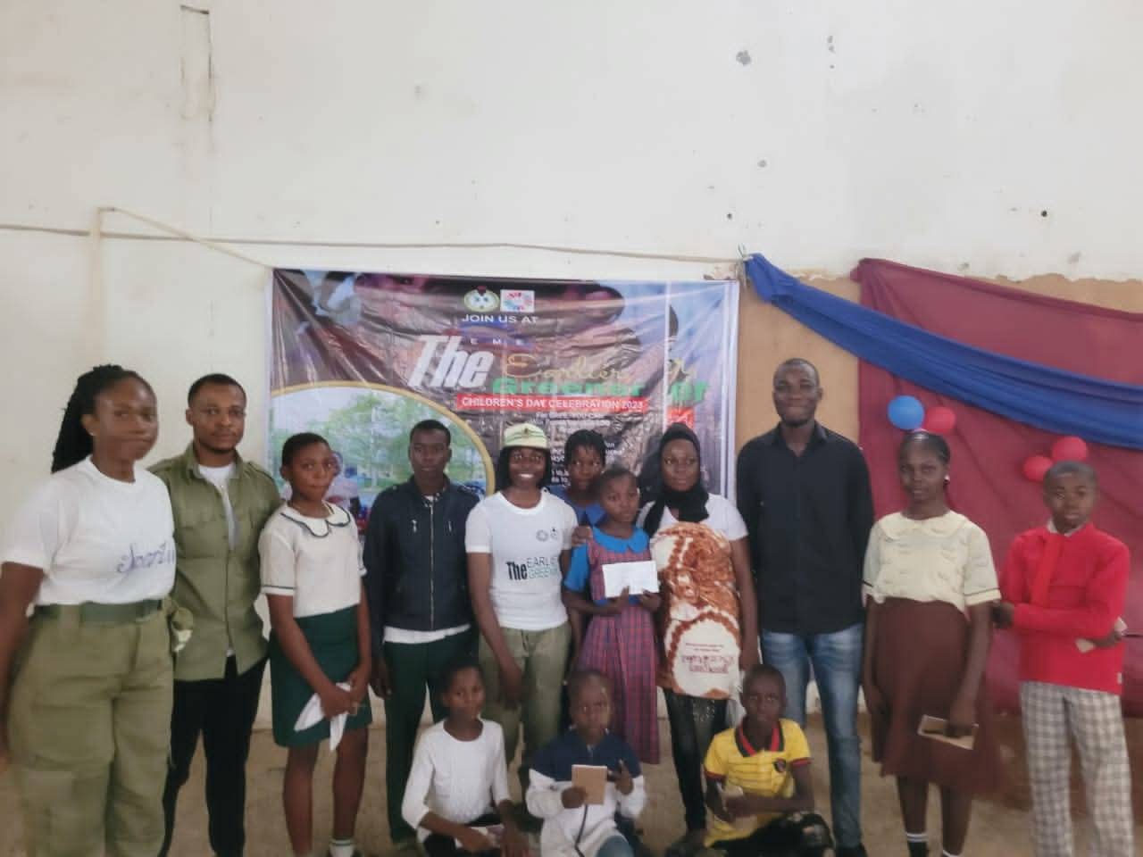 Earlier The Greener group photo with children